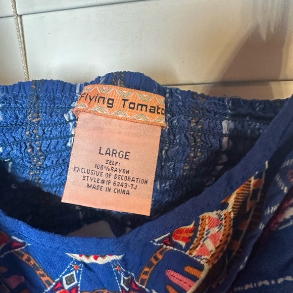 Blue and orange striped jumpsuit with adjustable straps and tie front - Picture 3 of 3